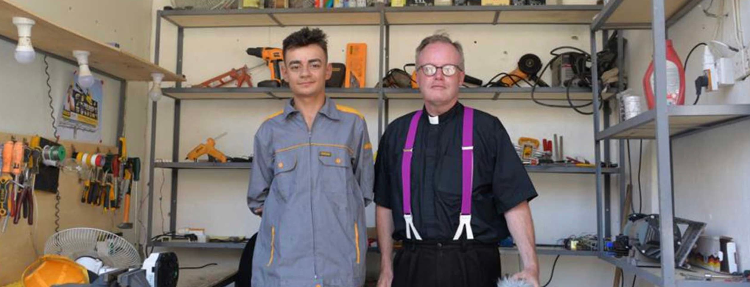 Fr. Ben with a member of the community