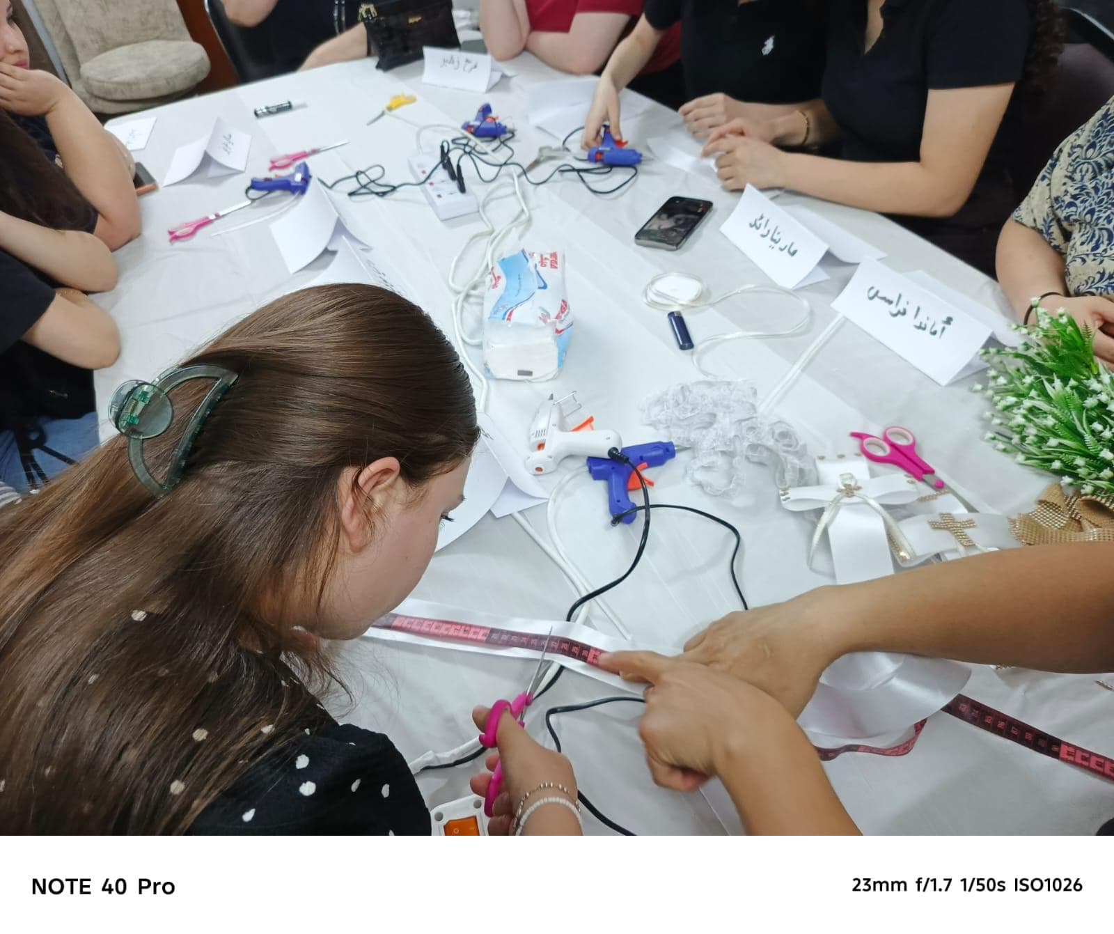 Women learning to make wedding decorations at the Ankawa training center